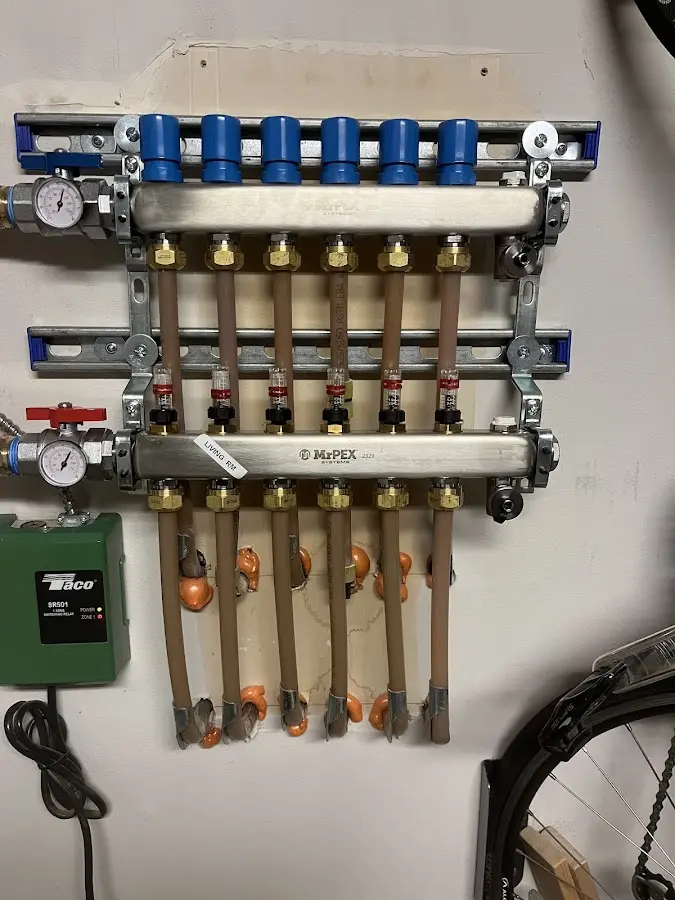 Plumber performing Water Heater Repair at a residential property in Mantua